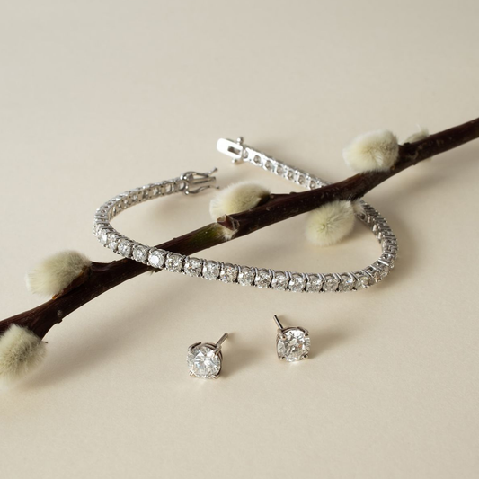 Diamond tennis bracelet and a pair of diamond stud earrings